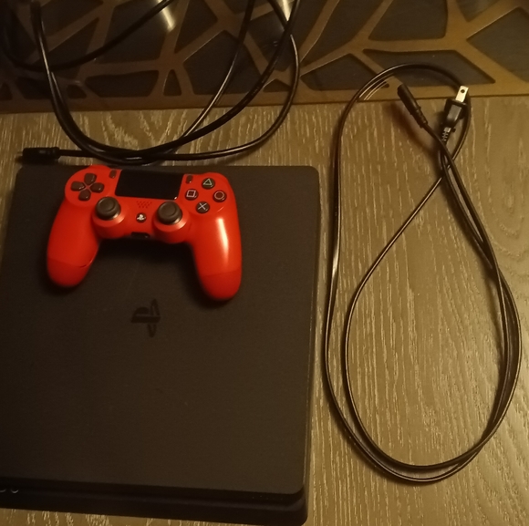 PS4 and  a red PS4 controller